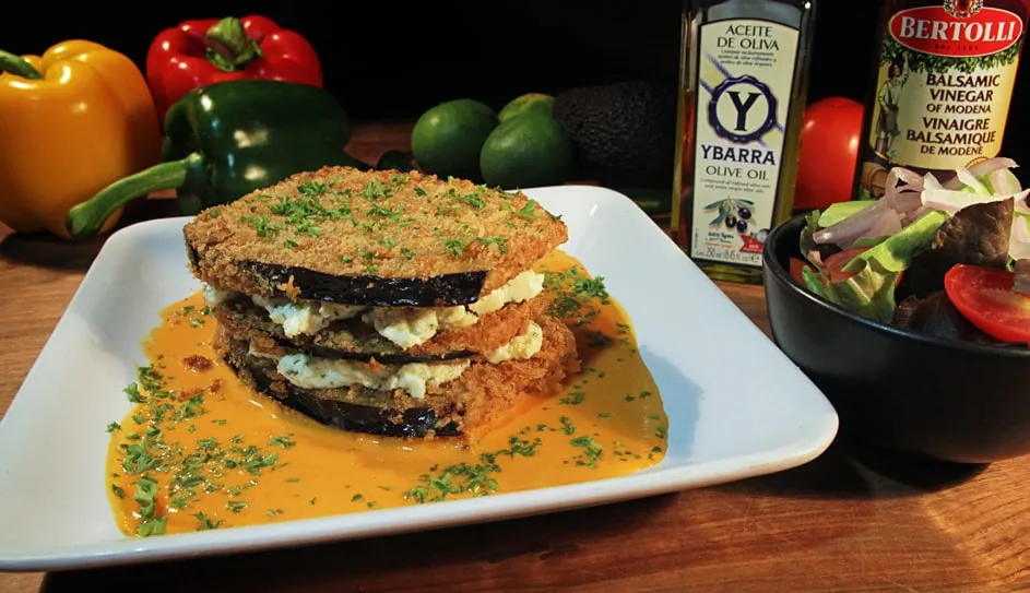 Layered baked eggplant in red capsicum sauce