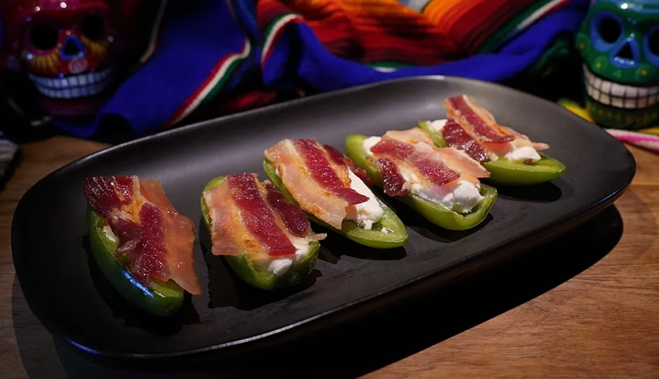 Baked stuffed jalapeños topped with bacon